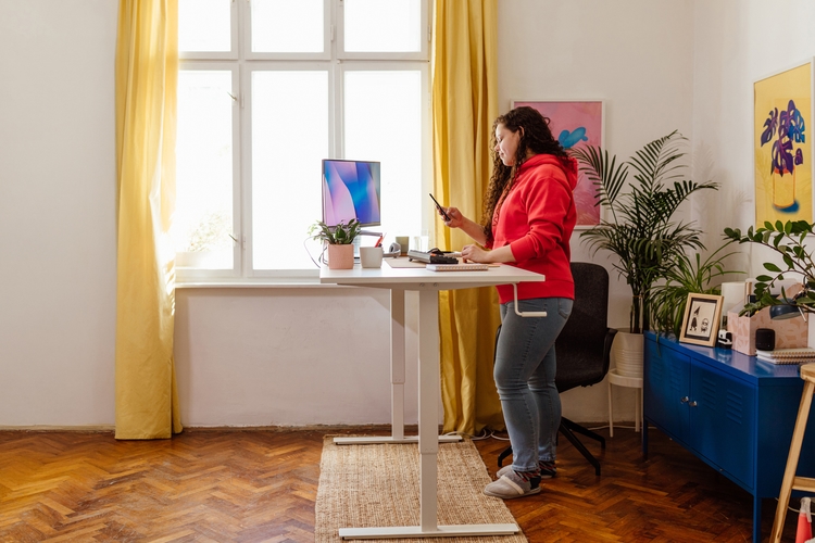 Woman working from home at standing desk